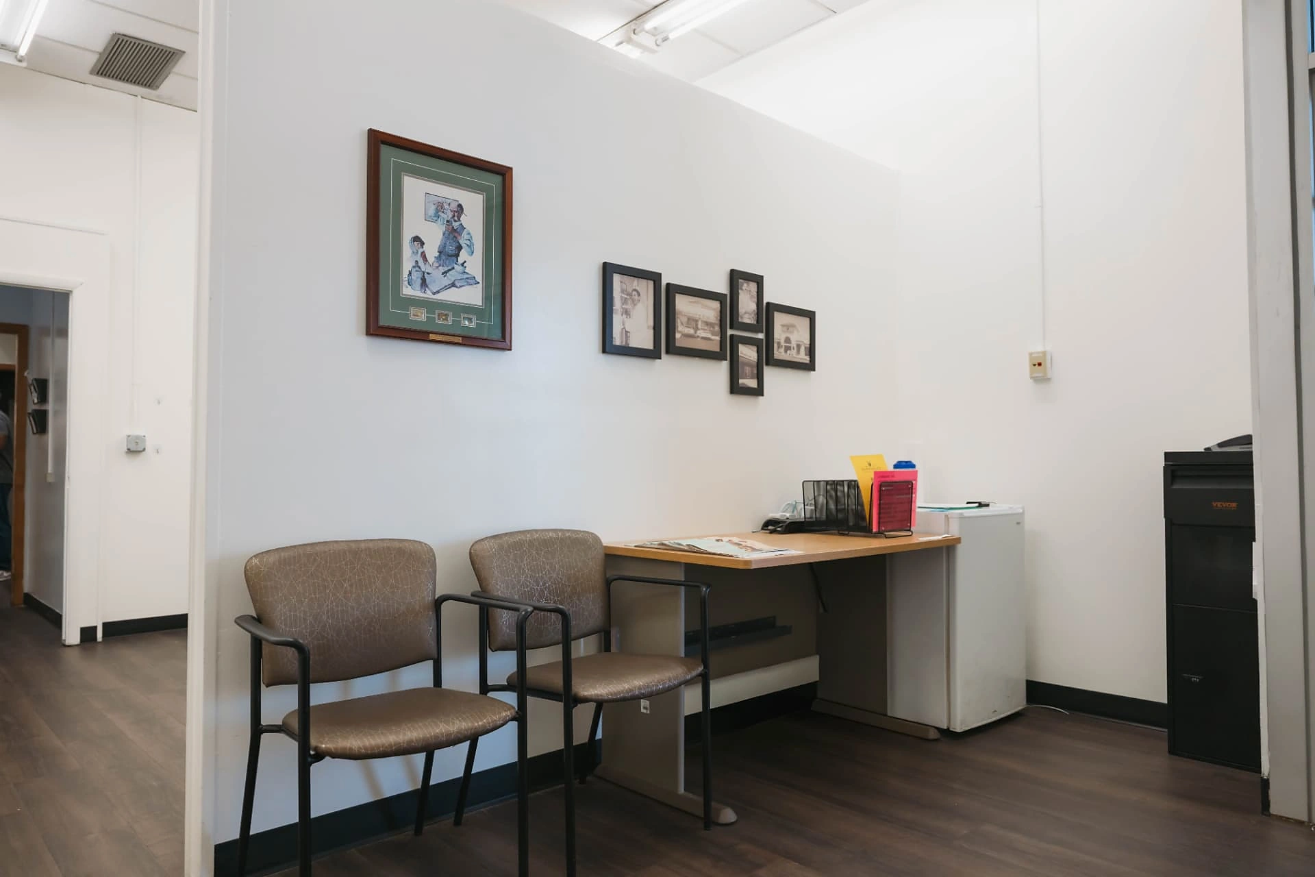 LTC & Hospice pharmacy lobby with seating and historic Dandurand photographs